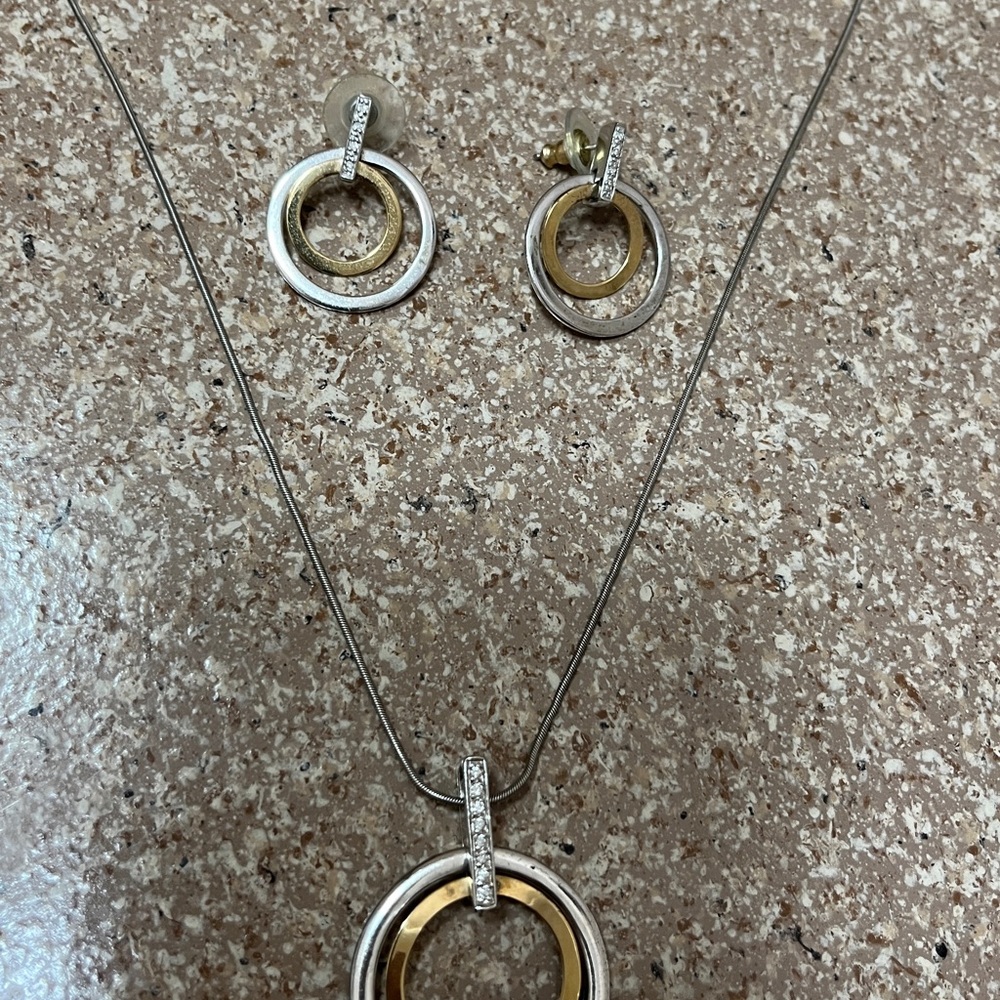 Necklace & earrings, hardly worn, they don’t tarnish, don’t know what metal.